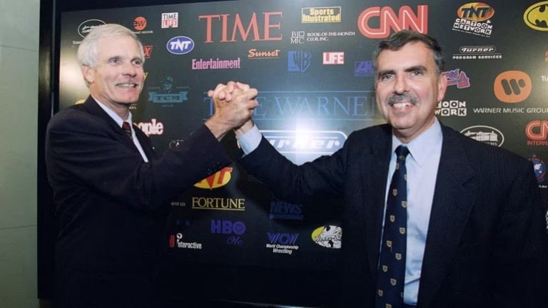 Ted Turner and Time Warner Chairman, along with CEO Gerald Levin, took a photo together during the merger of the two companies